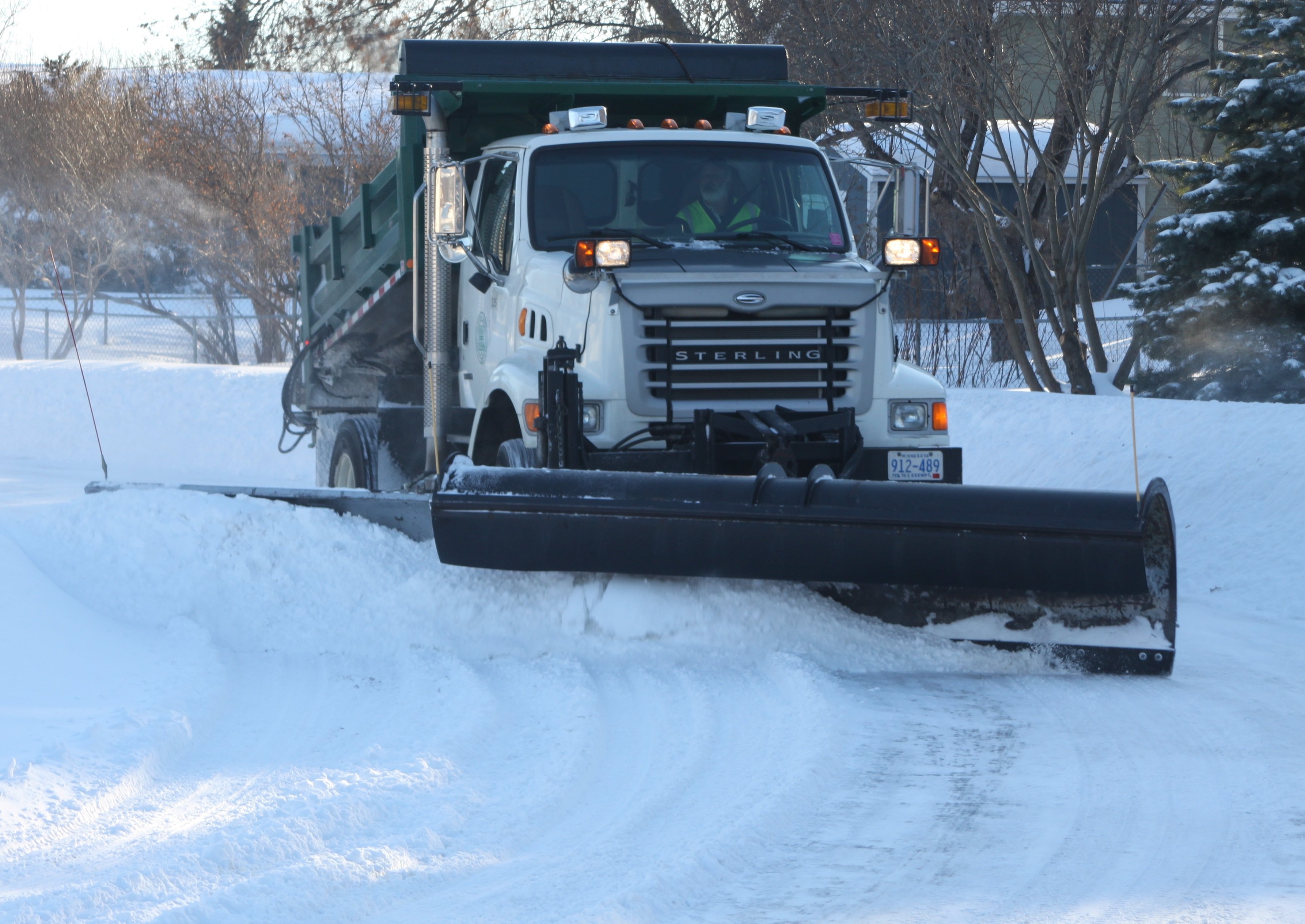 Severe damage is caused when snow plow blades dig in along the edges of the lawn.